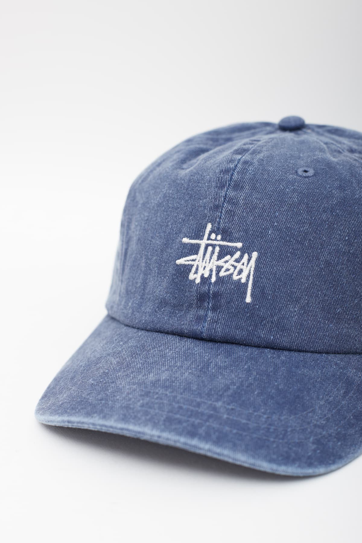STUSSY NAVY WASHED BASIC STOCK LOW PRO CAP IAMNUE