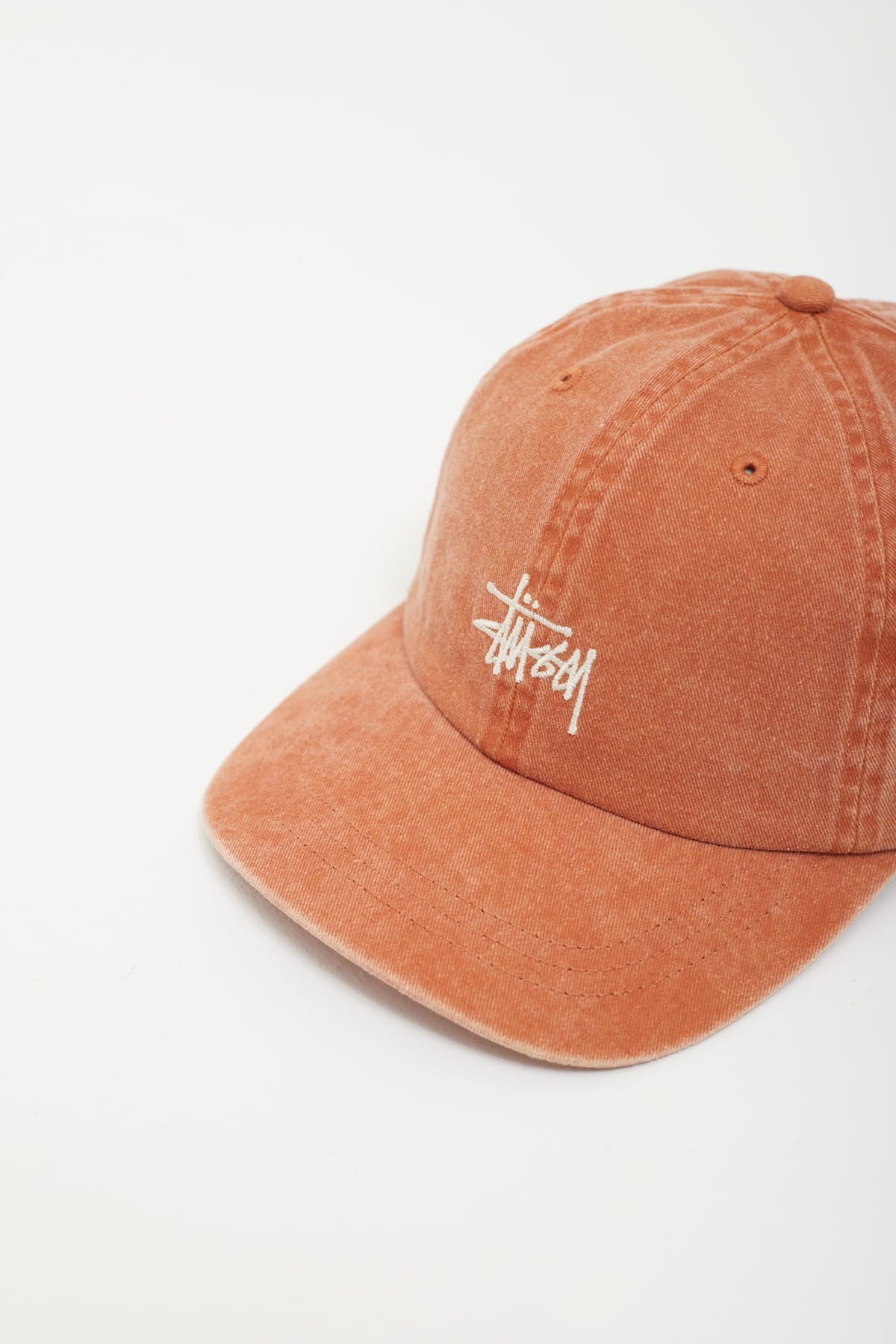 STUSSY RUST RED WASHED BASIC LOW PRO CAP IAMNUE