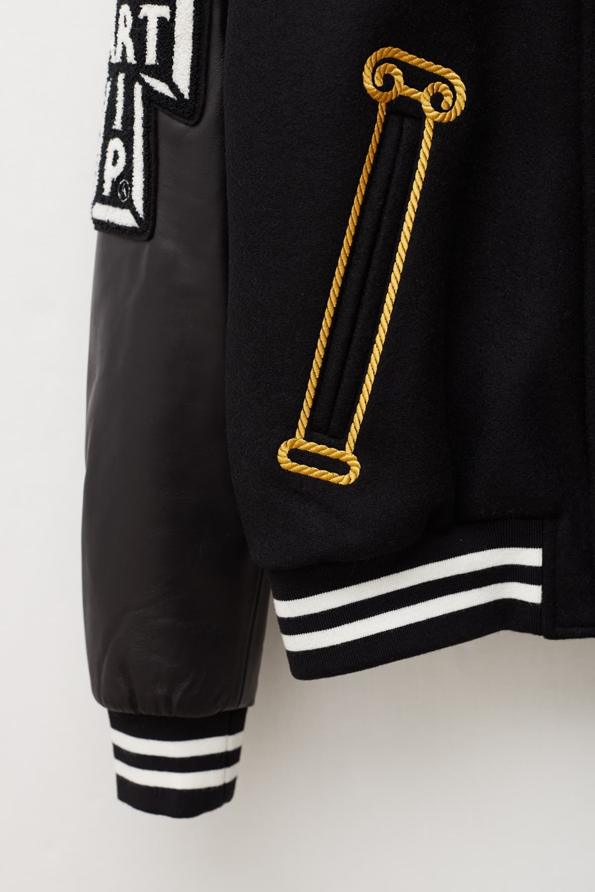 ARIES BLACK RAAW VARSITY JACKET | IAMNUE