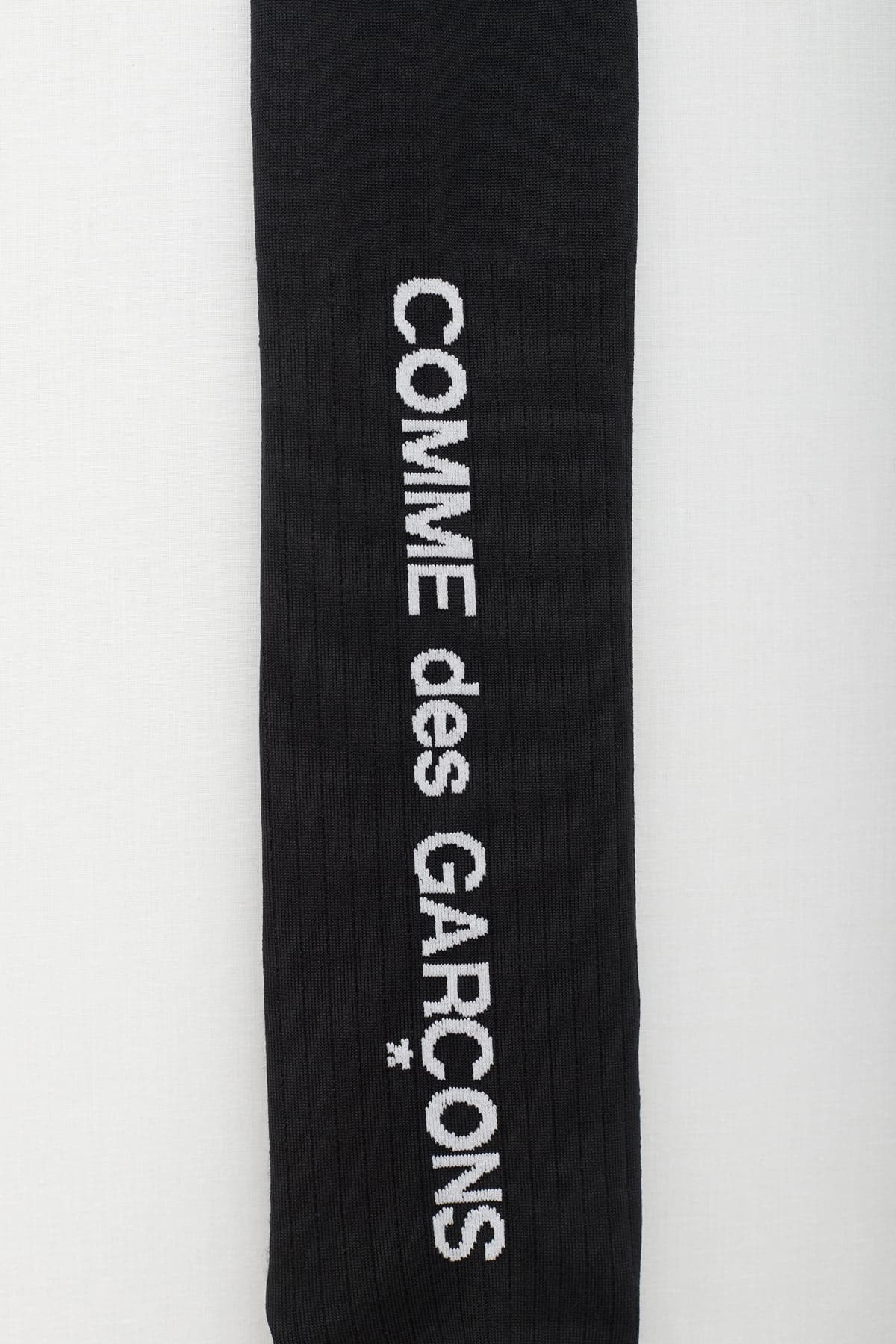 COMME DES GARCONS HOMME PLUS BLACK LOGO LONG SOCKS IAMNUE