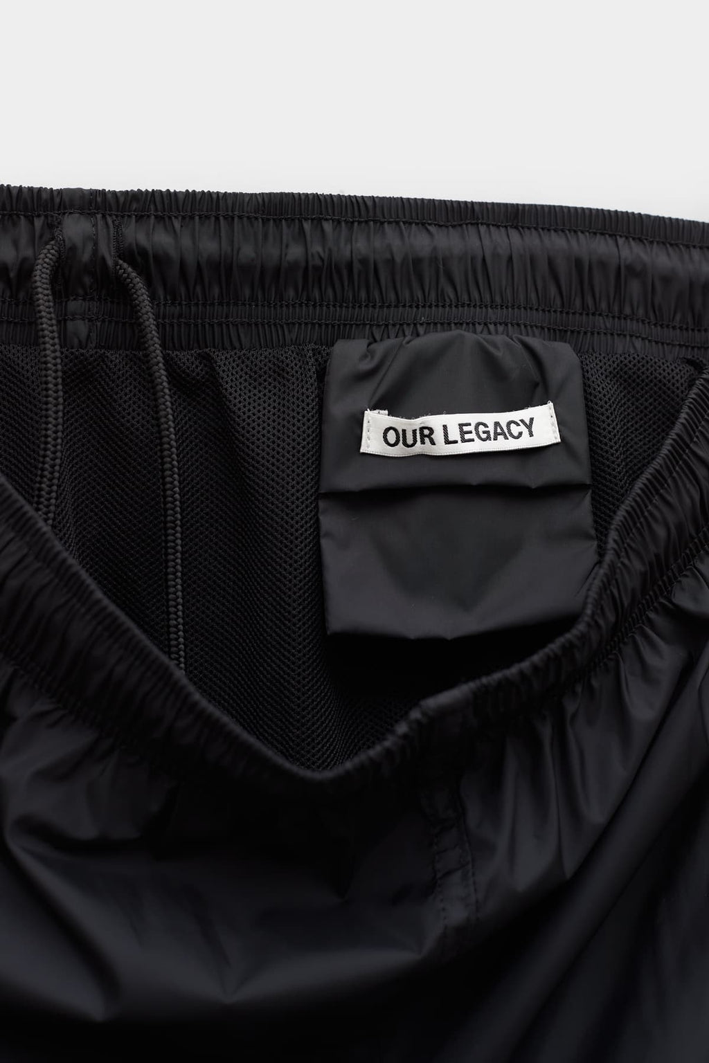 OUR LEGACY BLACK DRAPE TECH TRUNK SHORT