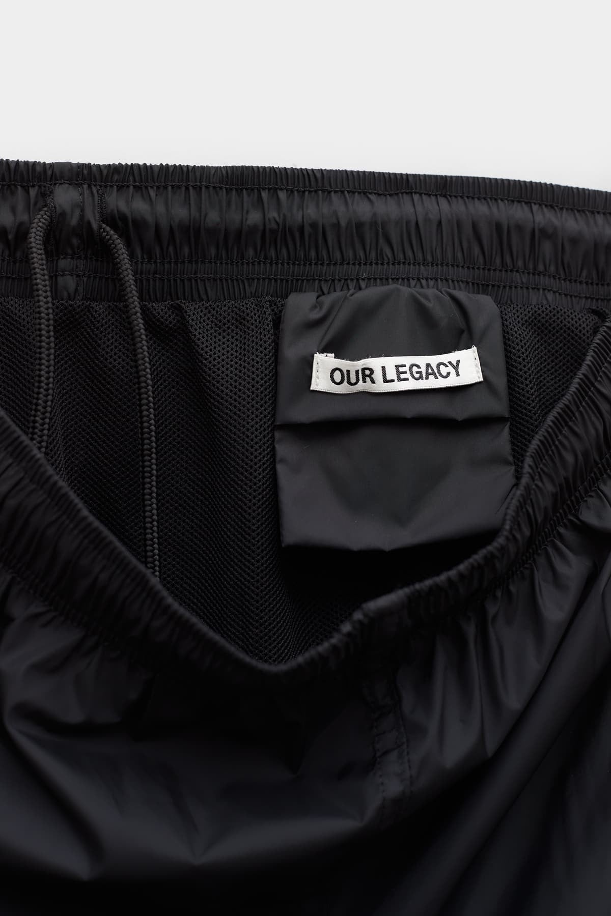 OUR LEGACY BLACK DRAPE TECH TRUNK SHORT