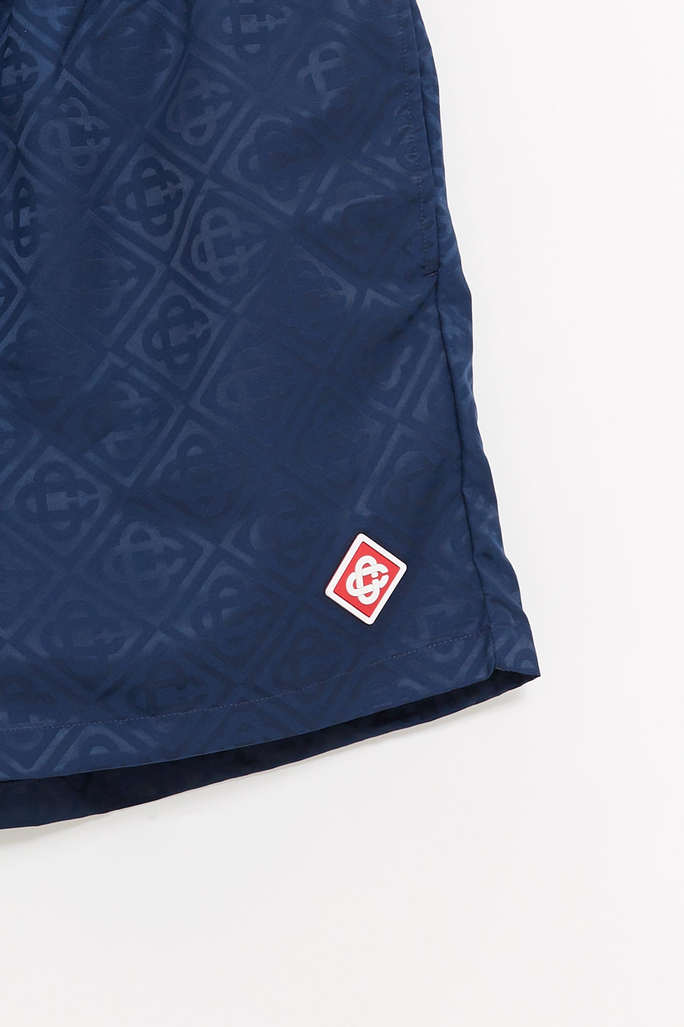 CASABLANCA NAVY MONOGRAM JACQUARD SWIM SHORTS
